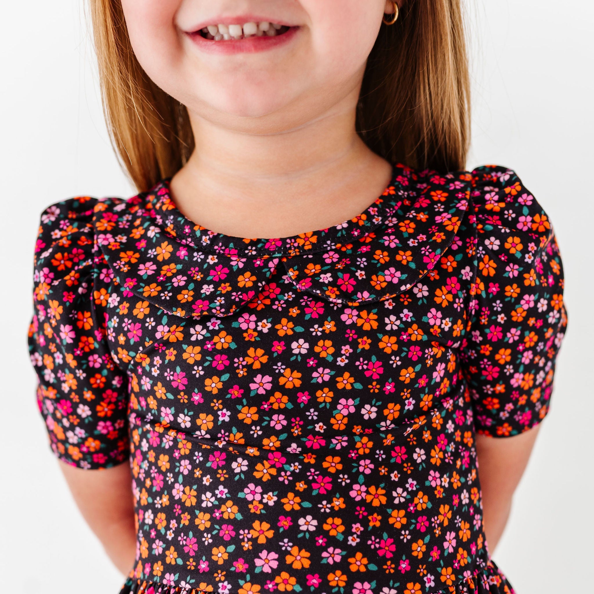 details of orange and pink dainty floral dress for halloween