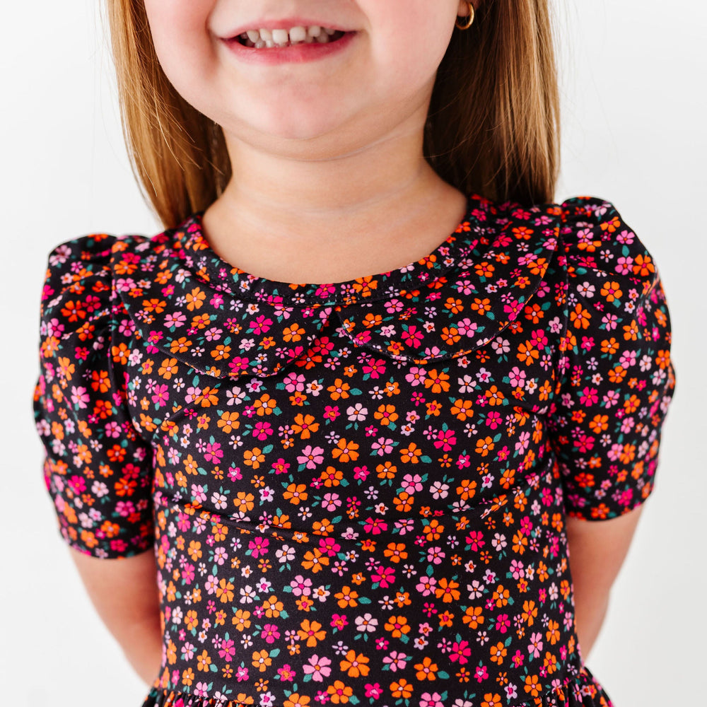 details of orange and pink dainty floral dress for halloween