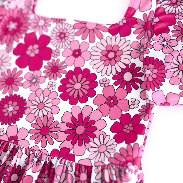 closeup of retro pink floral design on twirl dress bodice