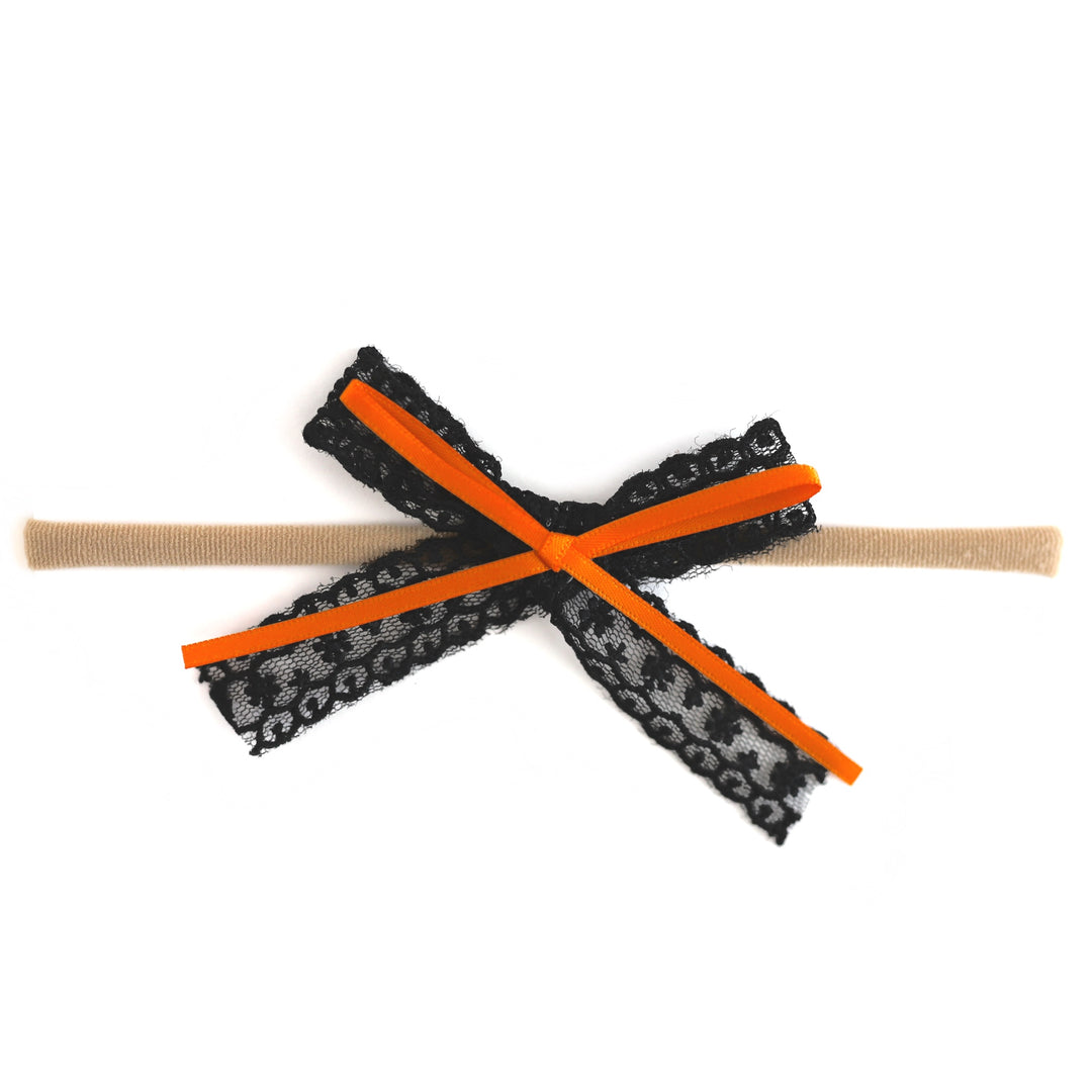 baby girl's black lace bow with orange satin ribbon on soft stretchy nylon headband for Halloween