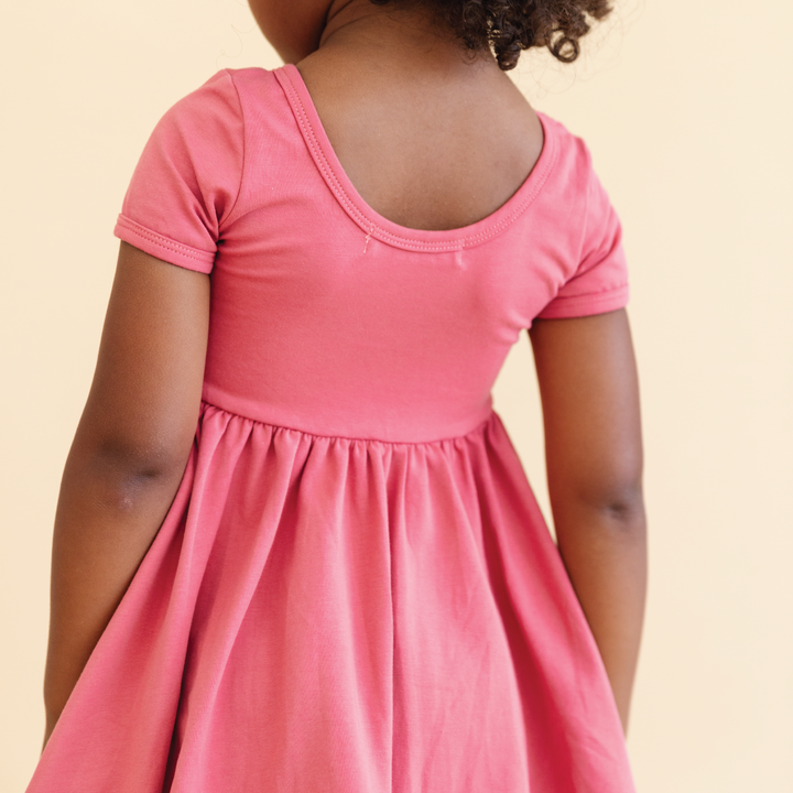 back view of pink scoop neck twirl dress for little girls