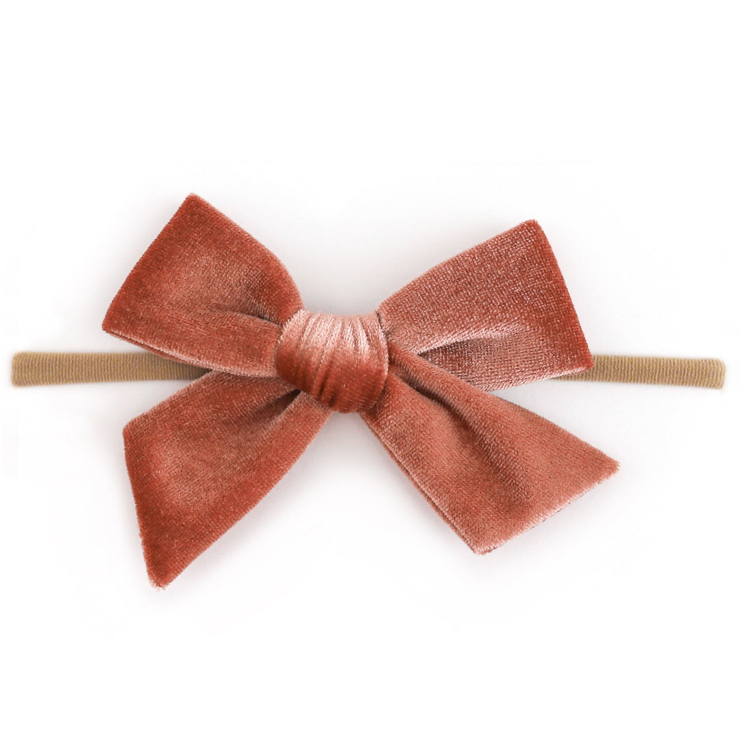 baby girl rust velvet hair bow on soft, stretchy nude elastic headband