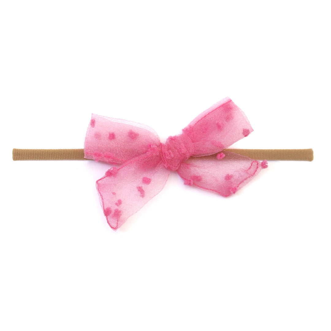 sheer taffy pink dot baby bow on nylon headband