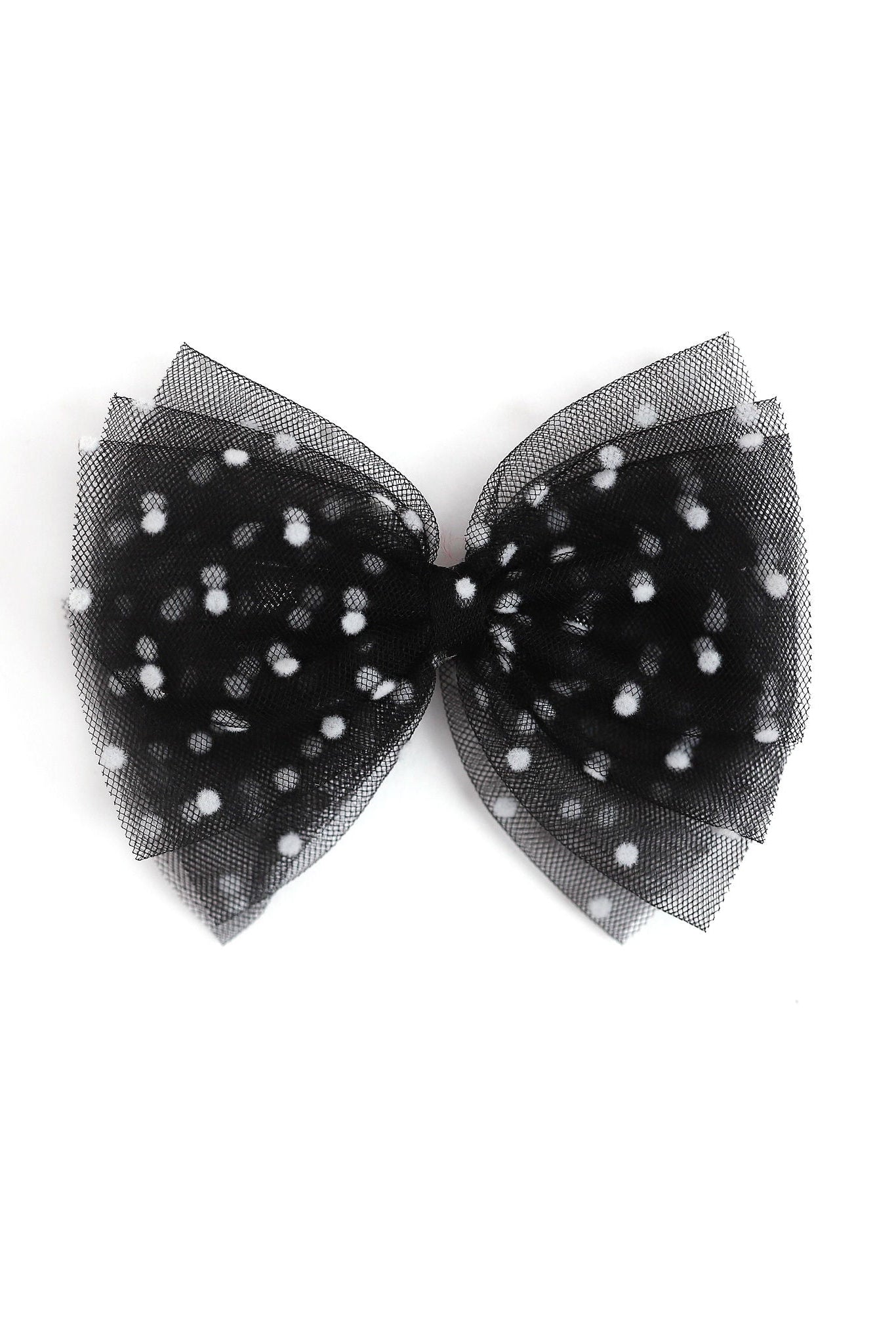 A black tulle bow decorated with small white polka dots, photographed against a solid white background.