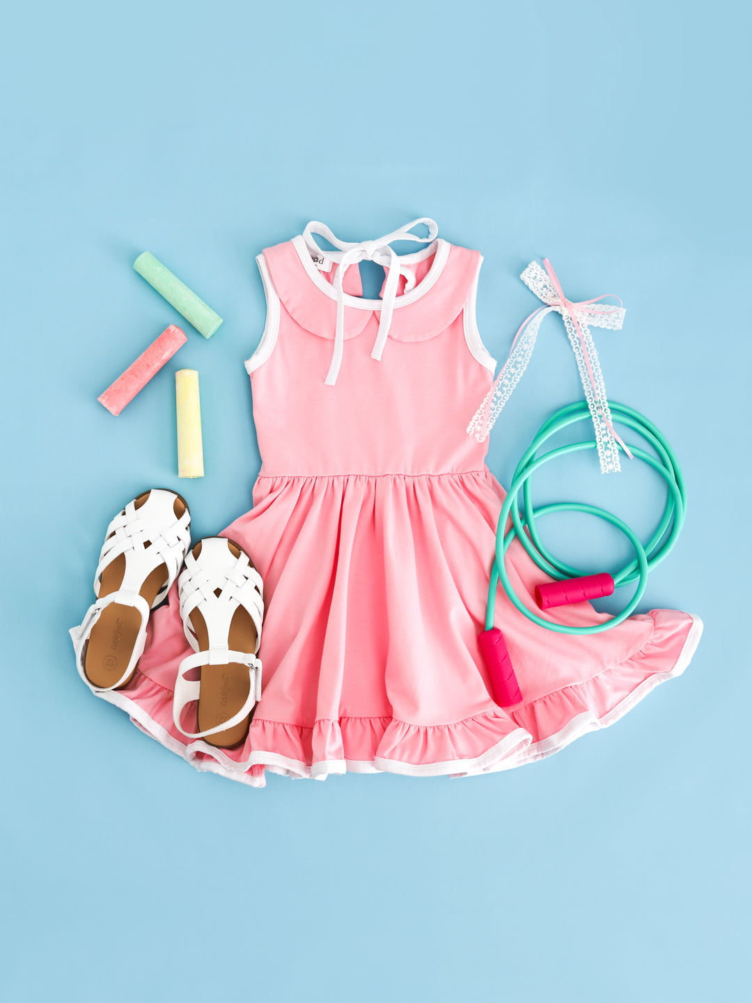 girls' pink sleeveless collared twirl dress with white trim styled for summer fun