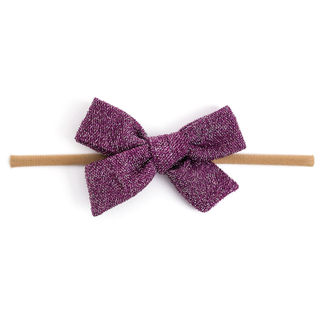 sparkly purple baby bow on nylon headband
