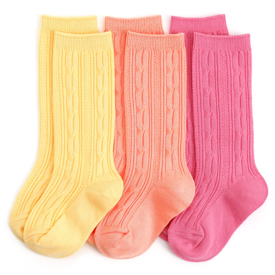 girls cable knit knee high socks in spring yellow, peach orange, and taffy pink