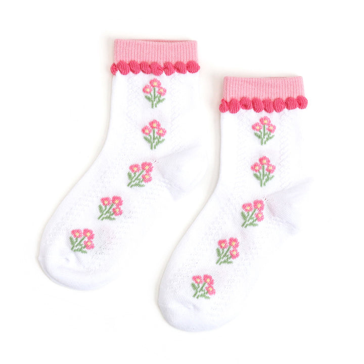 girl's white midi length socks with pink spring floral pattern and pink trim at the ankle