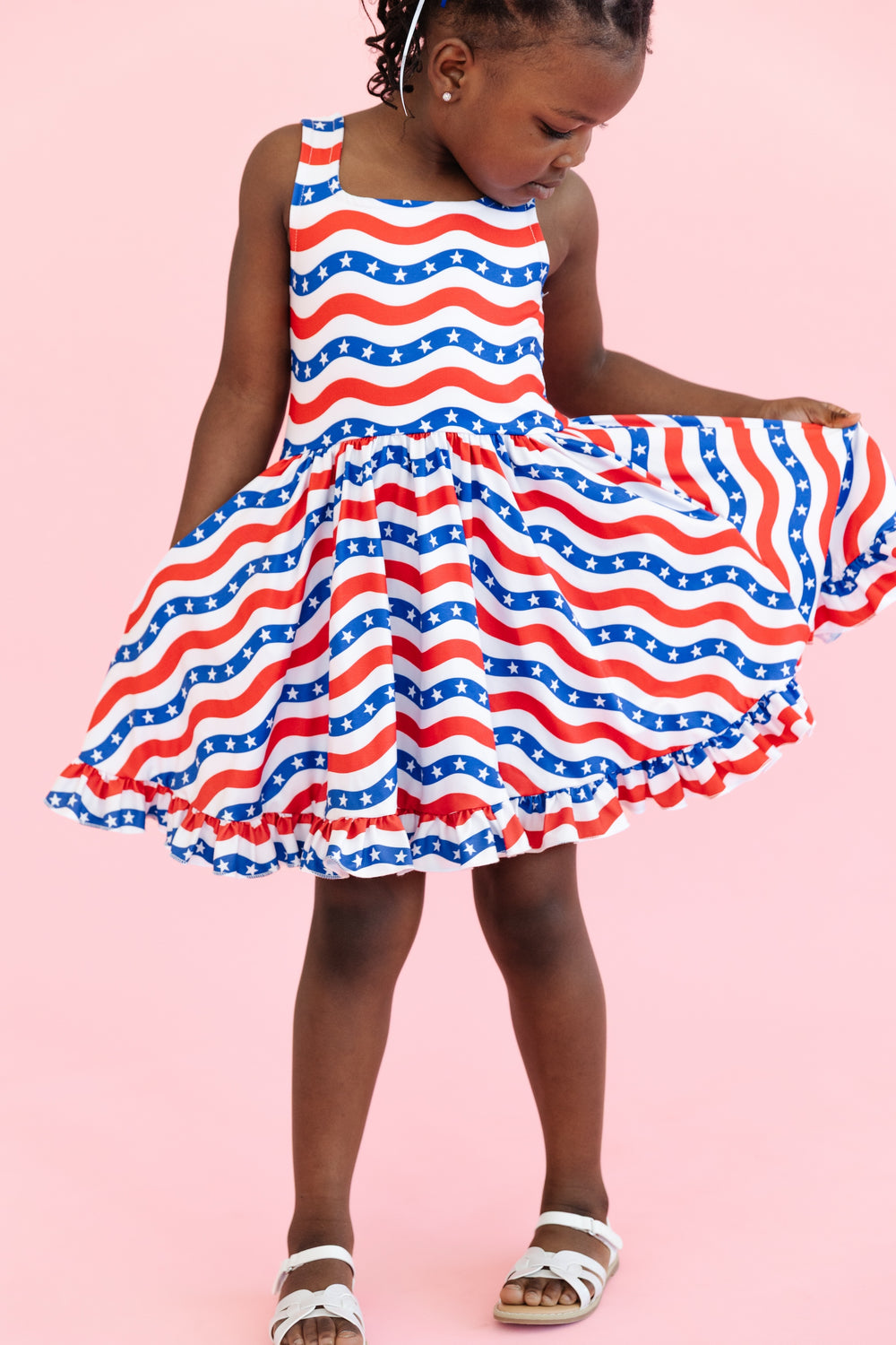 girl in red white and blue stars and stripes sleeveless dress