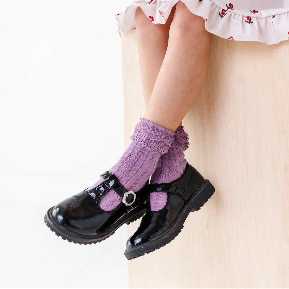 little girl in dusty purple pointelle knit lace top bobby socks for fall