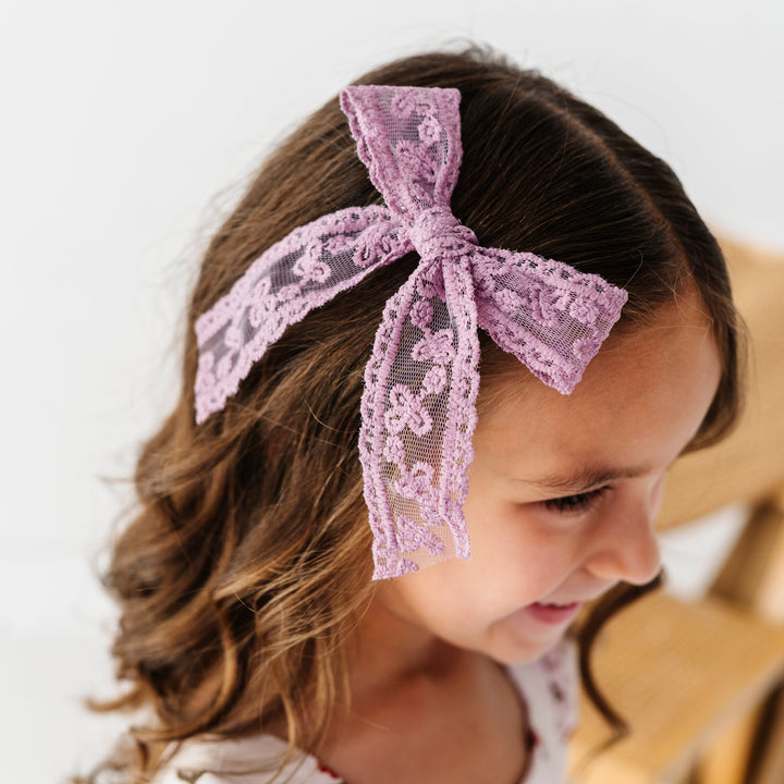 young girl in fall purple lace bow on alligator clip