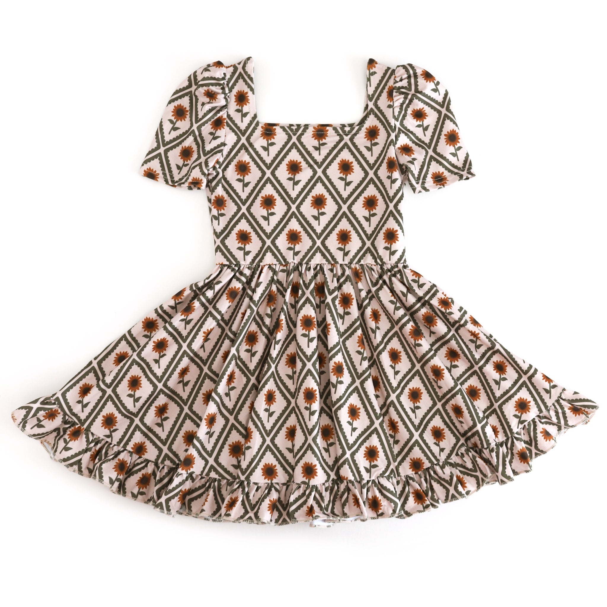 girl's square neck twirl dress with golden sunflowers, olive diamond pattern and cream background for fall photos