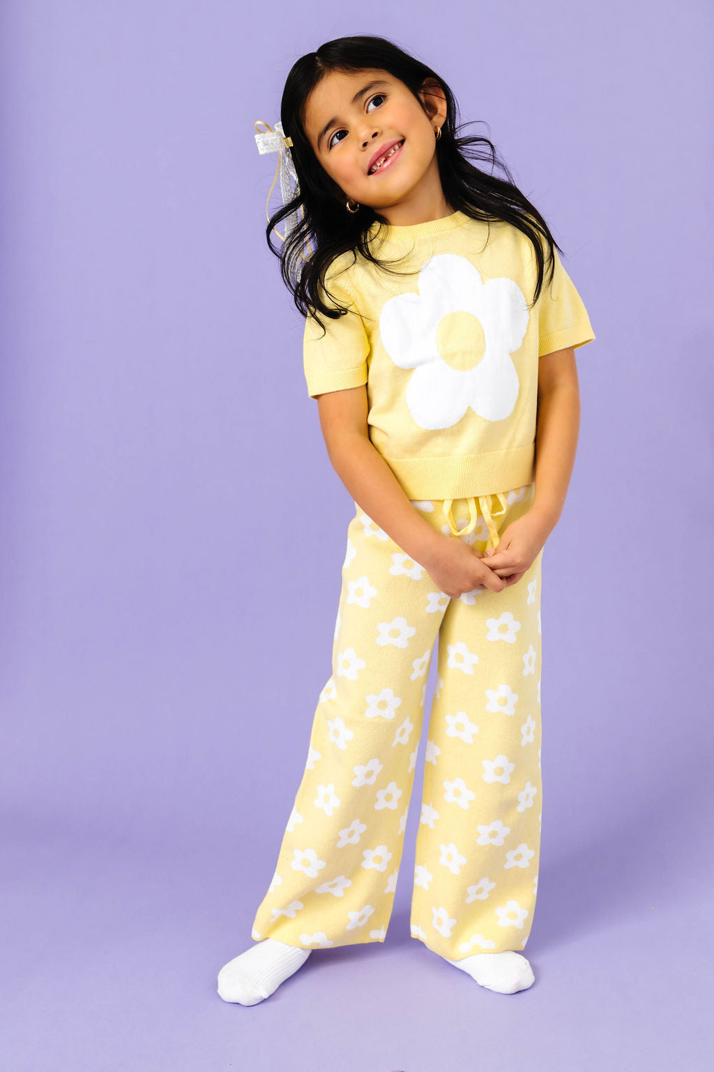 little girl in yellow short sleeve flower sweater with matching yellow cotton knit pants for spring