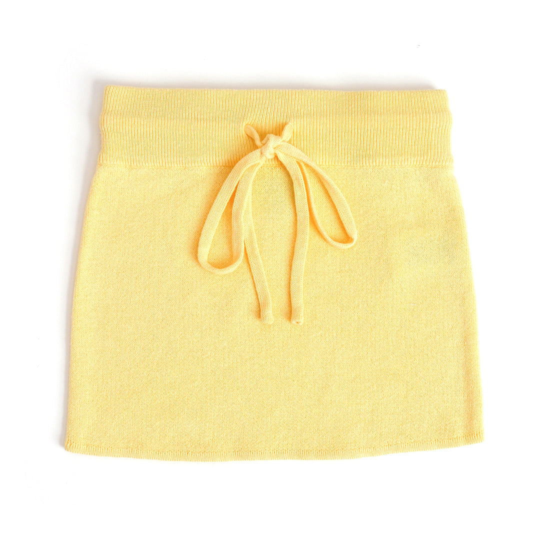 girl's cotton knit sweater skirt in pastel yellow with functional drawstring waistband for spring