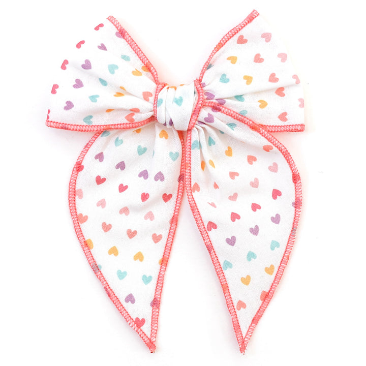 rainbow hearts hair bow with pink trim