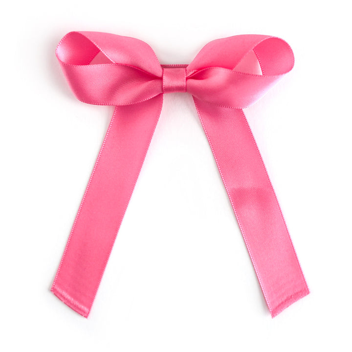 girls taffy pink satin hair bow on alligator clip covered in matching satin