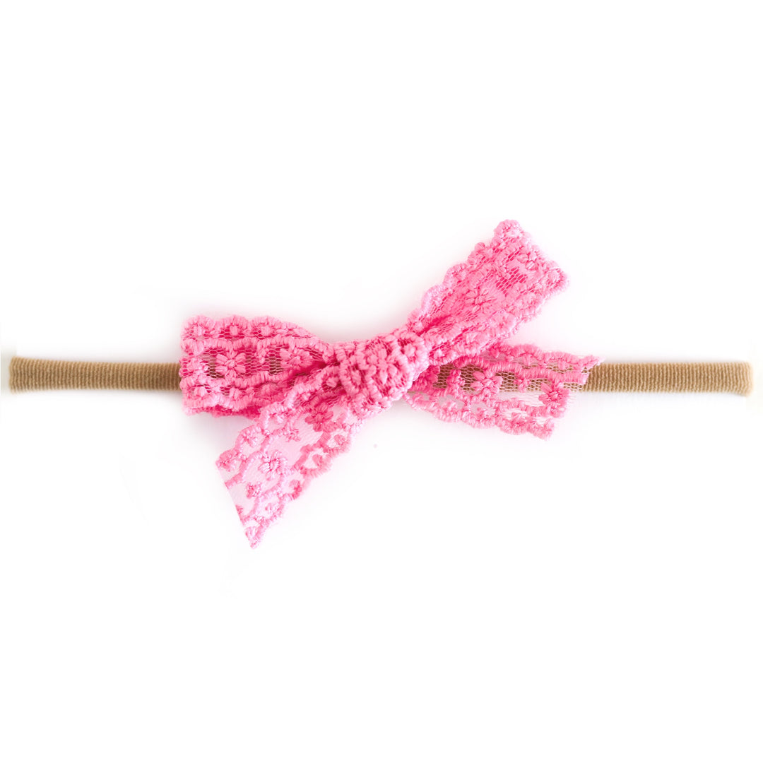 medium pink lace baby bow on tan nylon headband