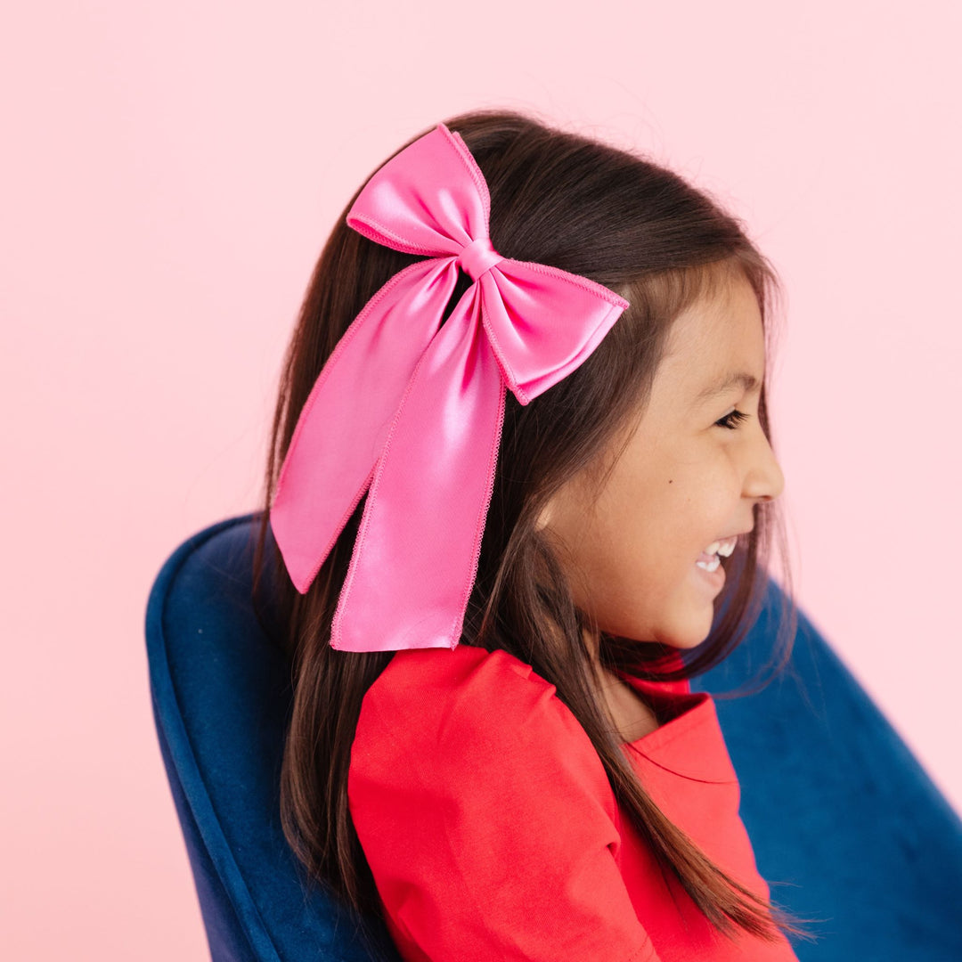 girls pink satin holiday bow with long tails