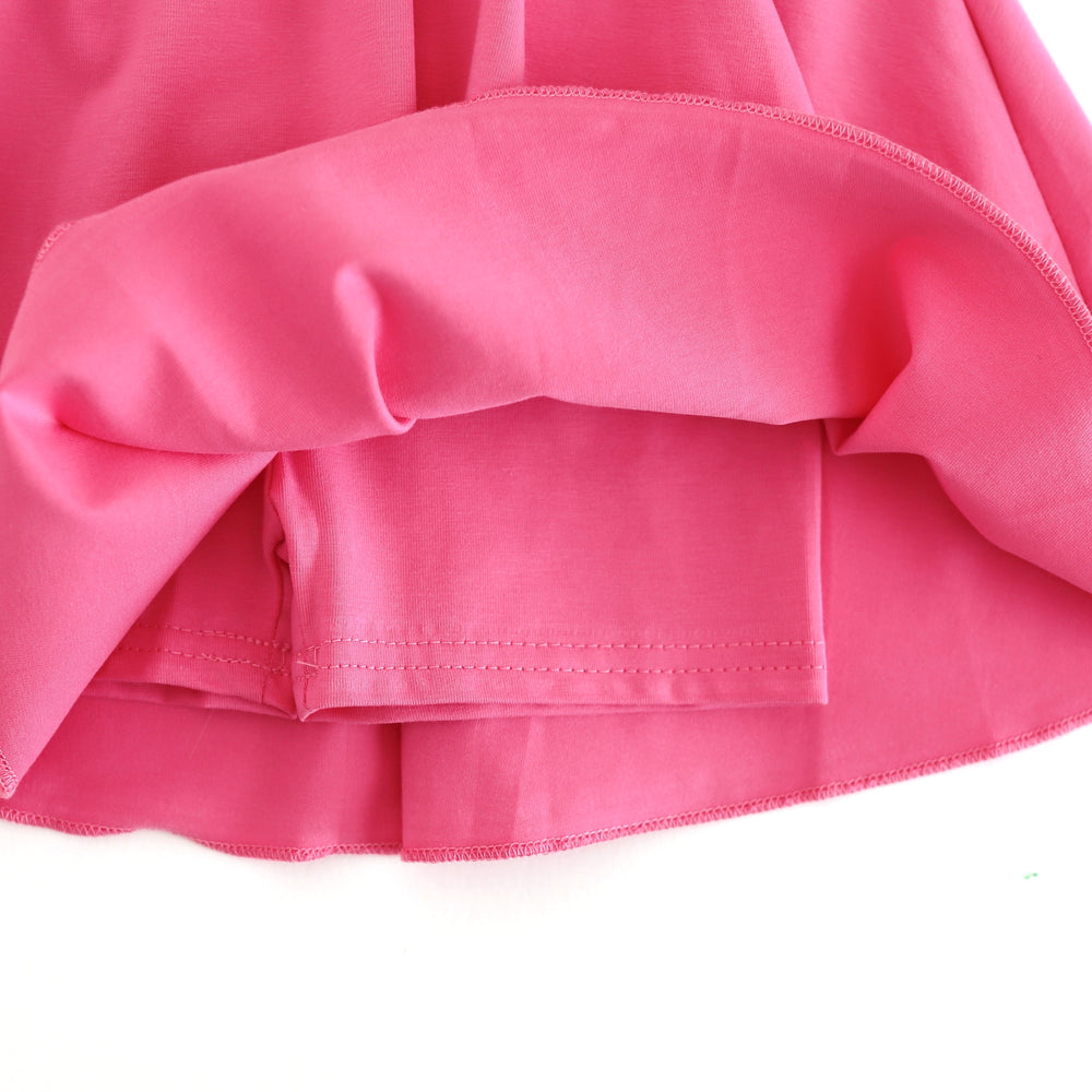 close up of built in matching pink cotton knit shorts attached to twirly spring skort