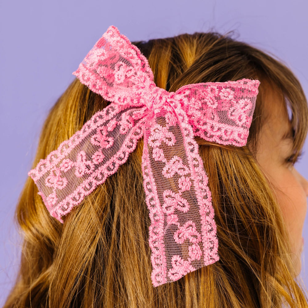 girl with pink lace hair bow on alligator clip