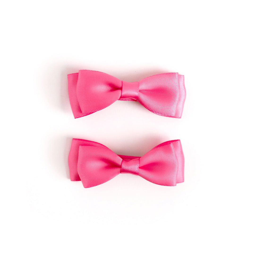 girls pink satin pigtail bows on clips to match Valentine's Day outfits