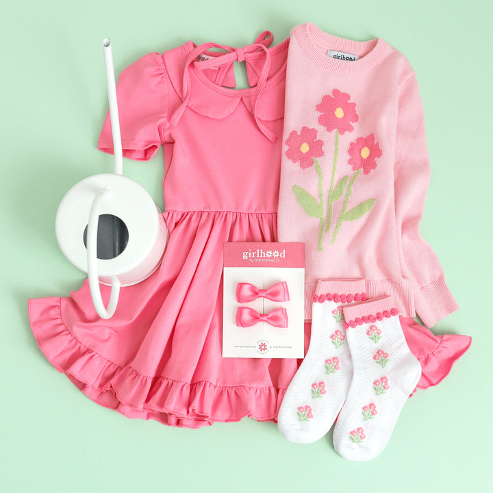 girl's spring outfit with pink twirl dress, pink flower pullover sweater and matching spring floral midi socks