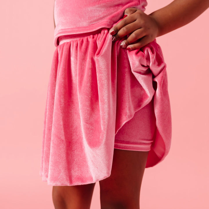 girl in pink velvet skort with attached velvet shorts to match velvet valentine's tops