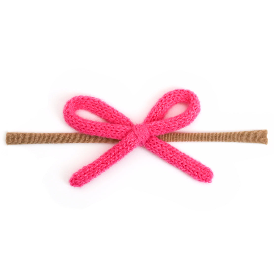 baby girls' taffy pink yarn spring hairbow on soft, stretchy nylon headband