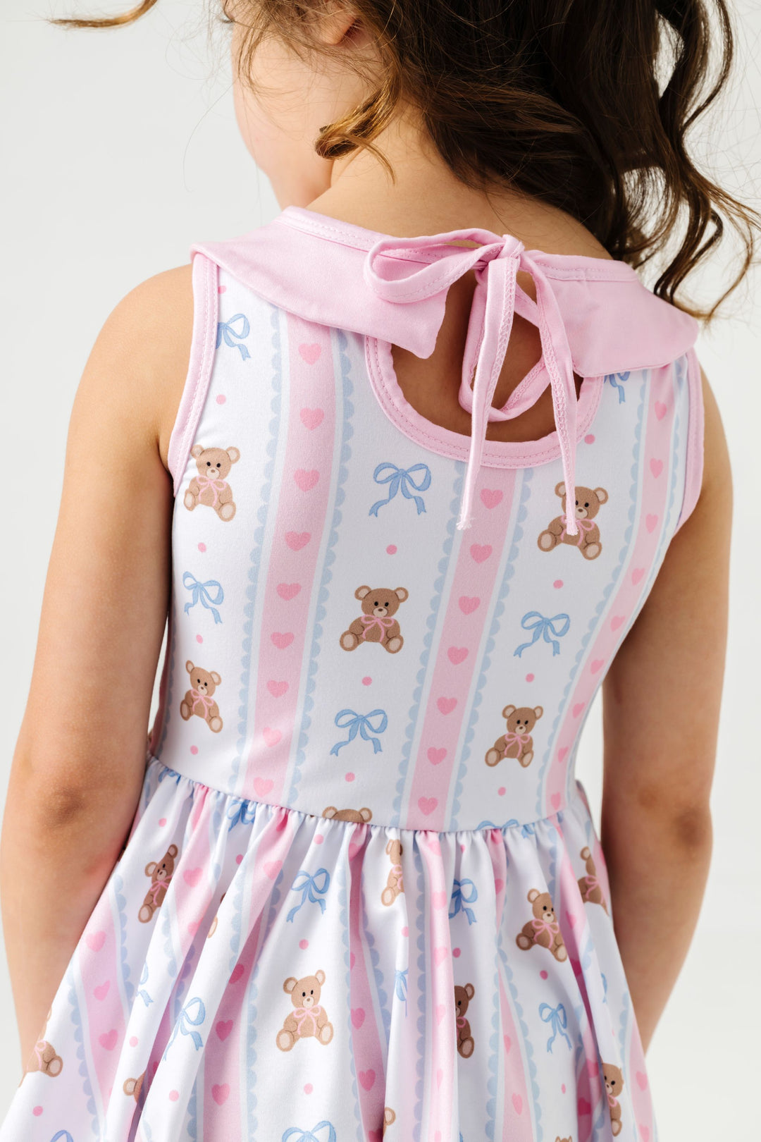 detail photo of the keyhole tie back of teddy bear print collared sleeveless twirl dress