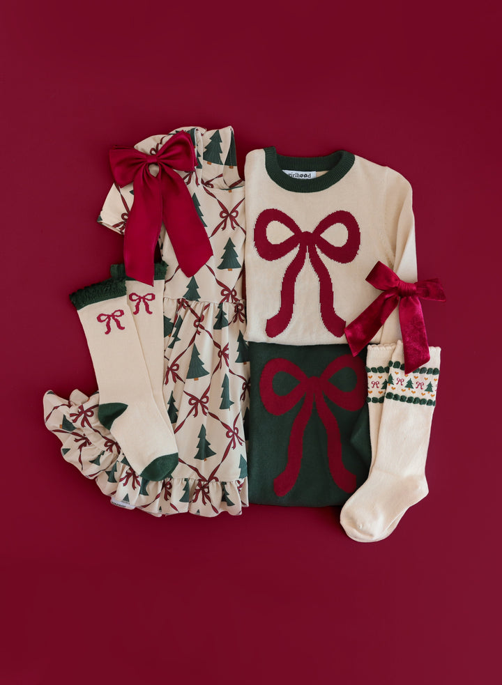 girls crimson bow themed Christmas mix and match featuring Christmas tree dress with crimson ribbon detail and matching sweaters, socks and bows