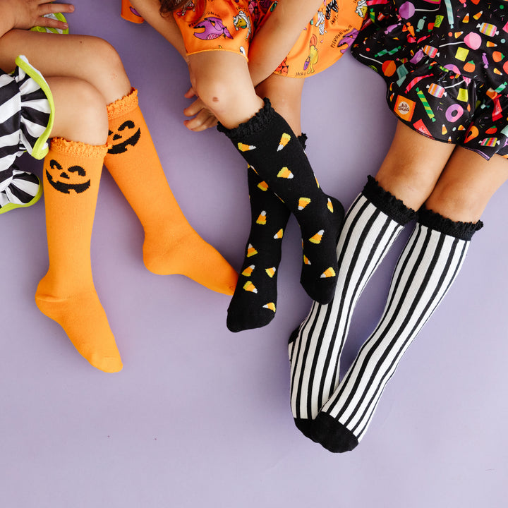 little girls wearing halloween knee high socks