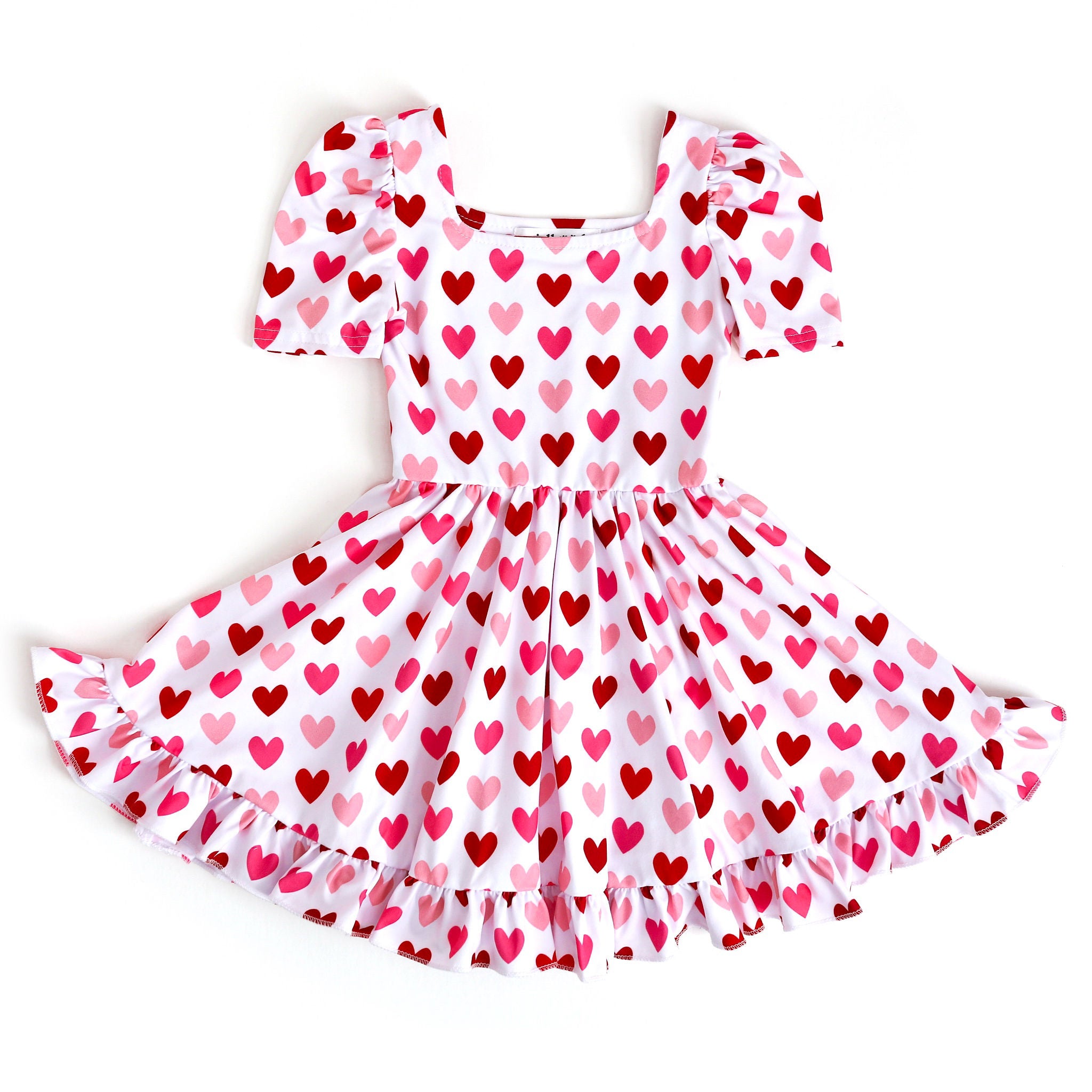 Girls Valentines Day twirl dress with red and pink hearts printed on white