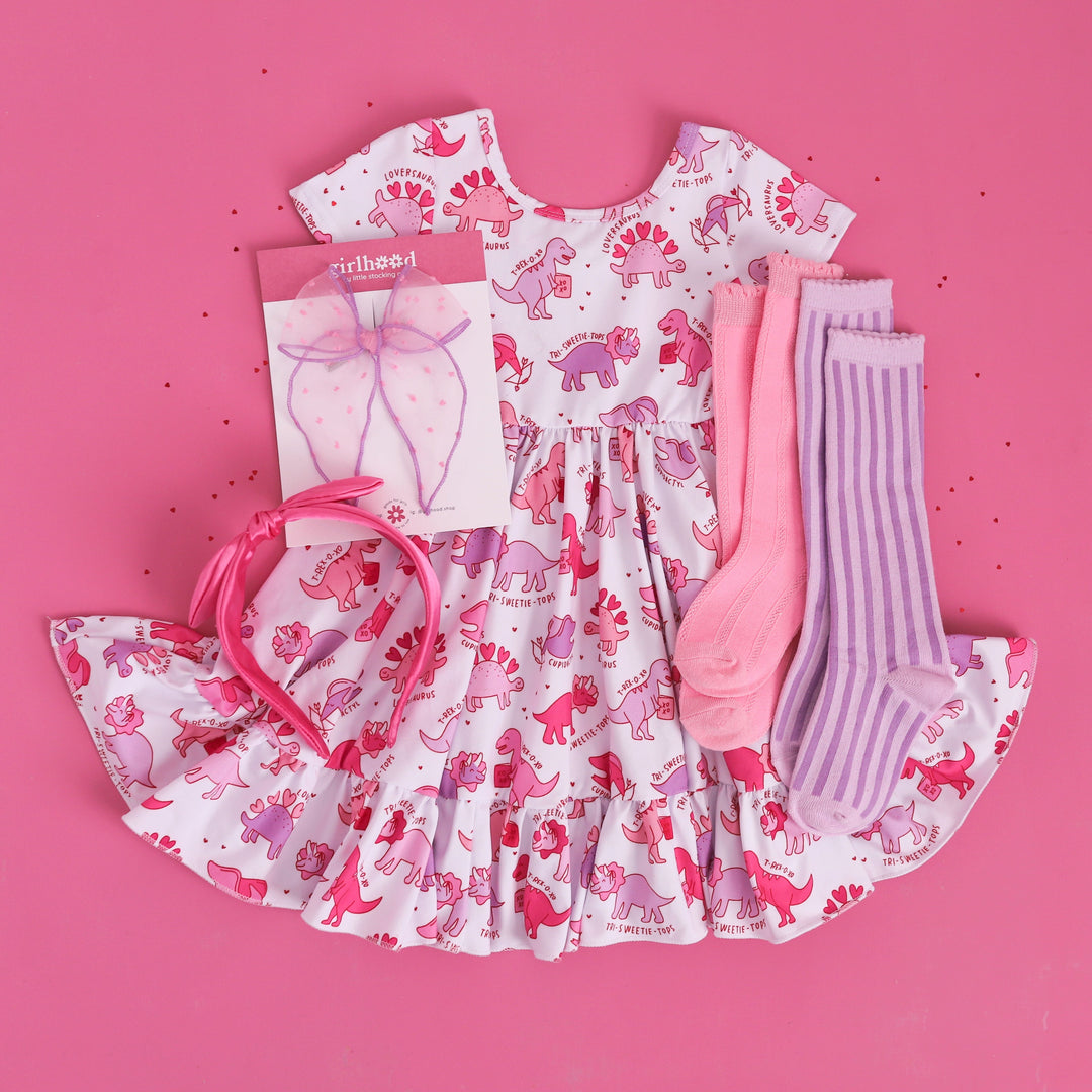 girl's Valentine's day twirl dress with pink and purple pastel dinos print and matching accessories