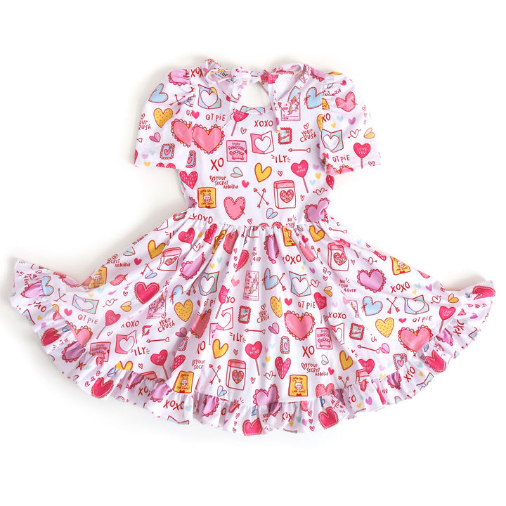 girls twirl dress with pastel Valentine's Day cards and treats print on white