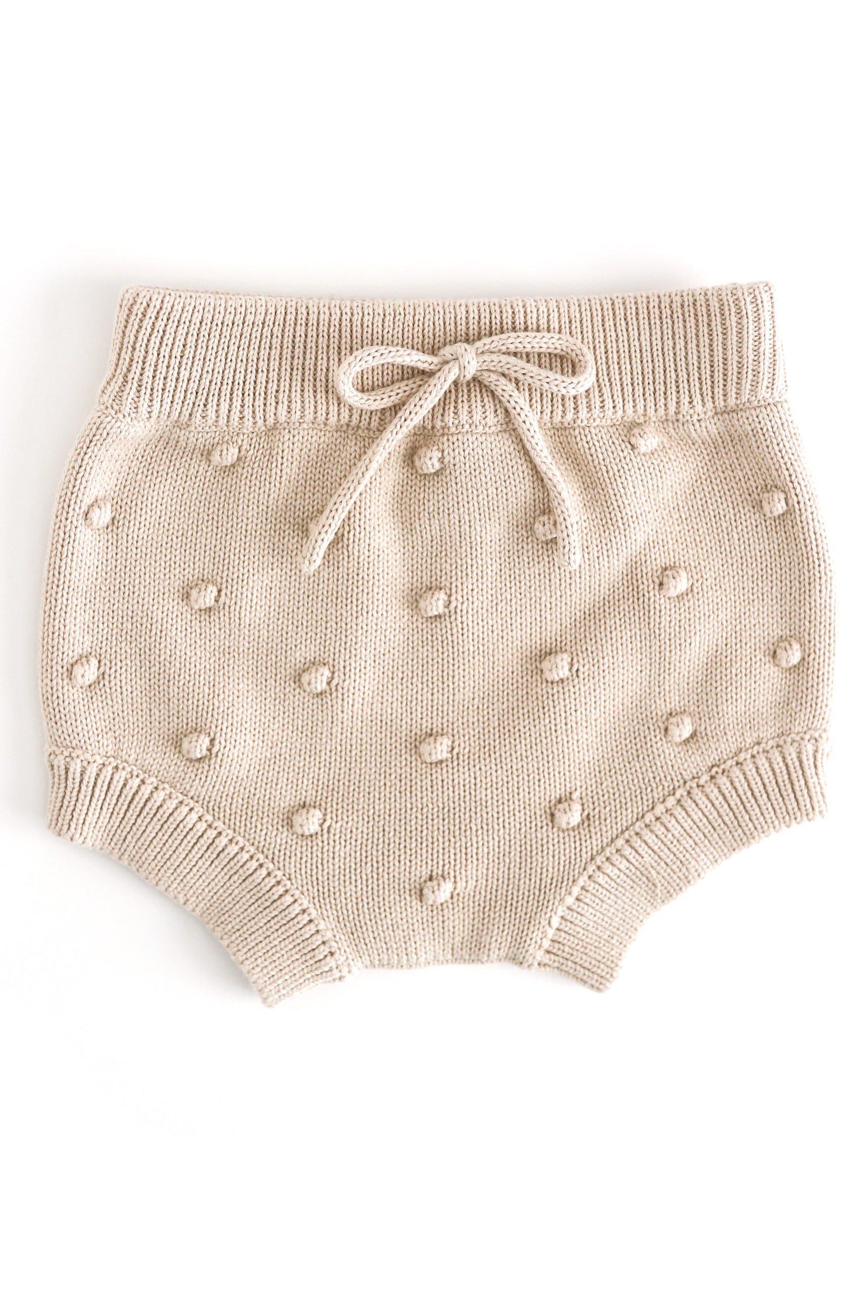baby girl's cream knit bloomers with faux tie at the waist and 3D bubble texture