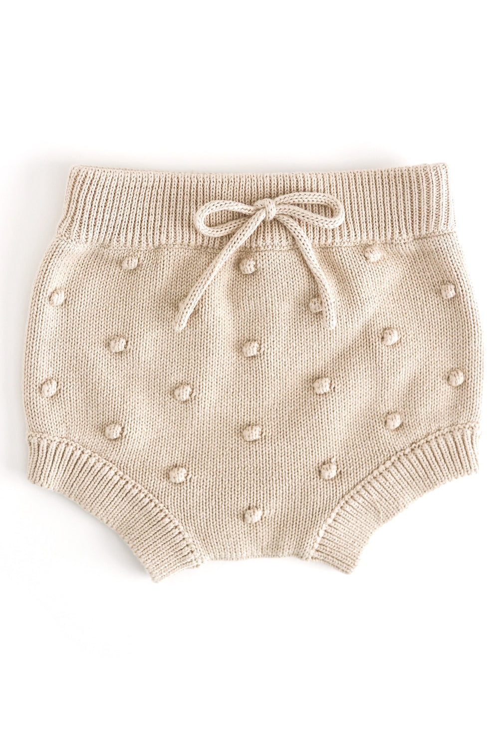 baby girl's cream knit bloomers with faux tie at the waist and 3D bubble texture