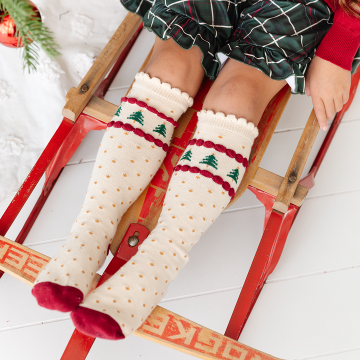 vanilla socks with line of christmas trees and crimson red accents and gold polkadots