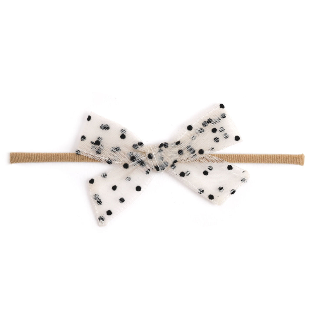 sheer vanilla polka dot baby bow on nylon headband