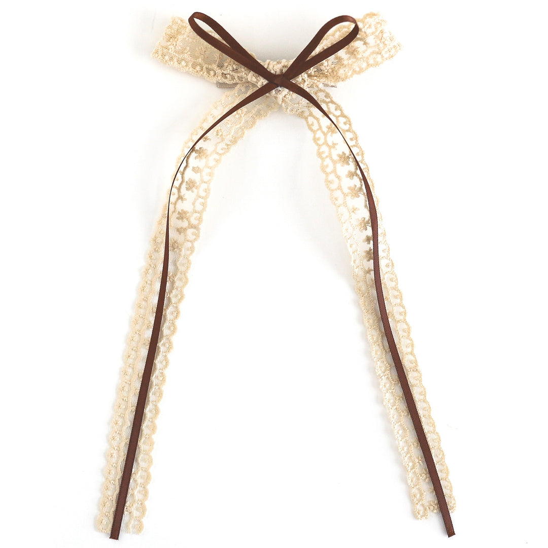vanilla long tail lace bow with brown satin ribbon embellishment on alligator clip