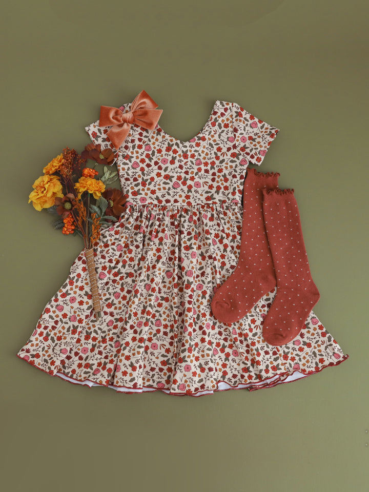 girls' cream fall floral v-neck twirl dress paired with rust dottie knee socks and rust velvet hair bow