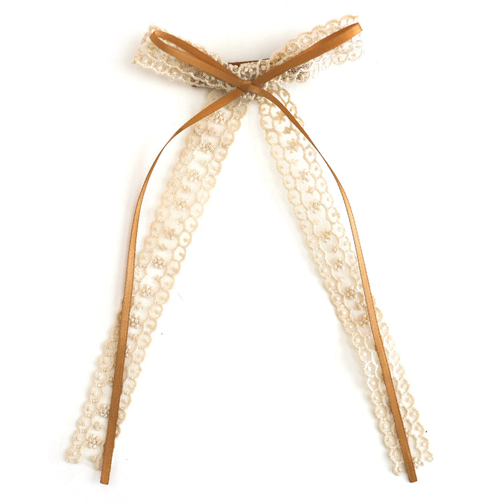 girls' double bow featuring lace long tail bow in cream with thin mustard ribbon attached on clip