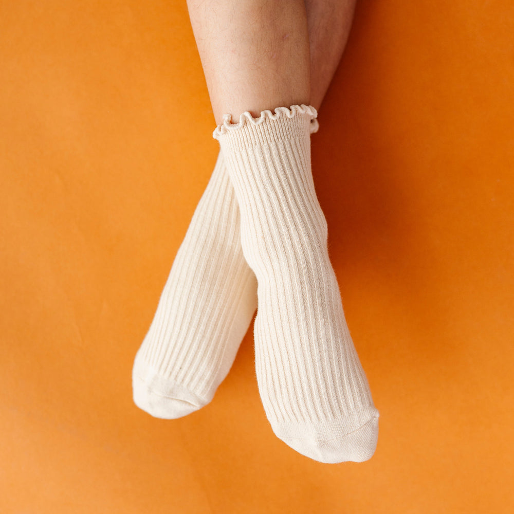 girl wearing cream ribbed midi socks with lettuce trim
