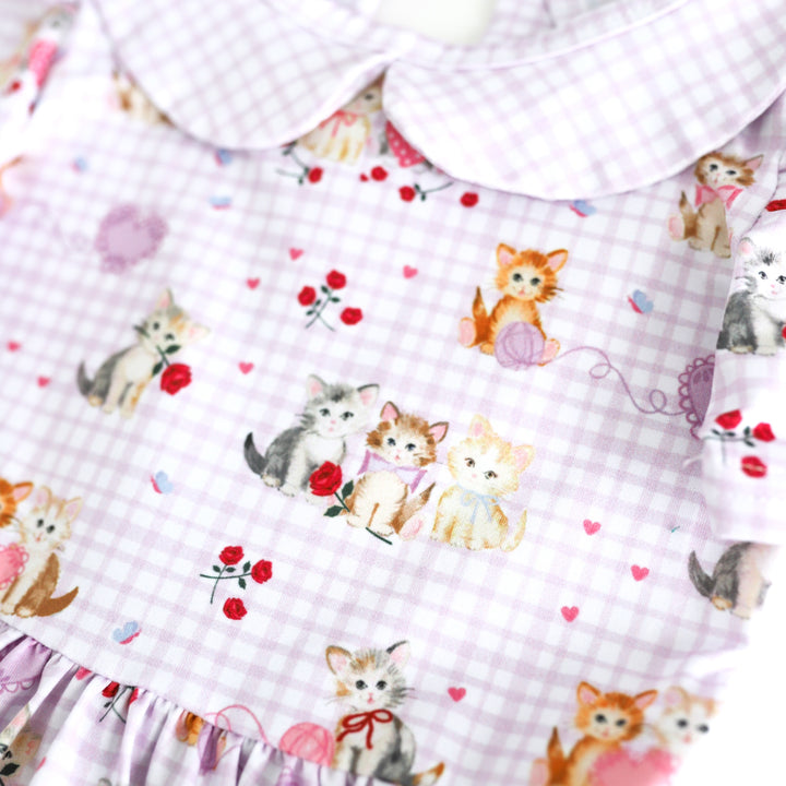 closeup collared twirl dress bodice with vintage kitten print with lavender gingham on white base