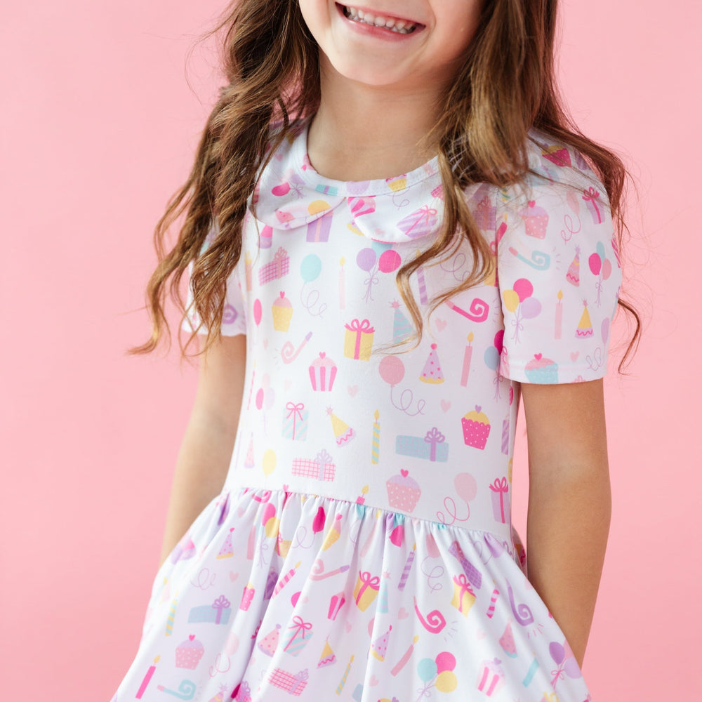 detail picture of girl wearing birthday dress with peter pan collar