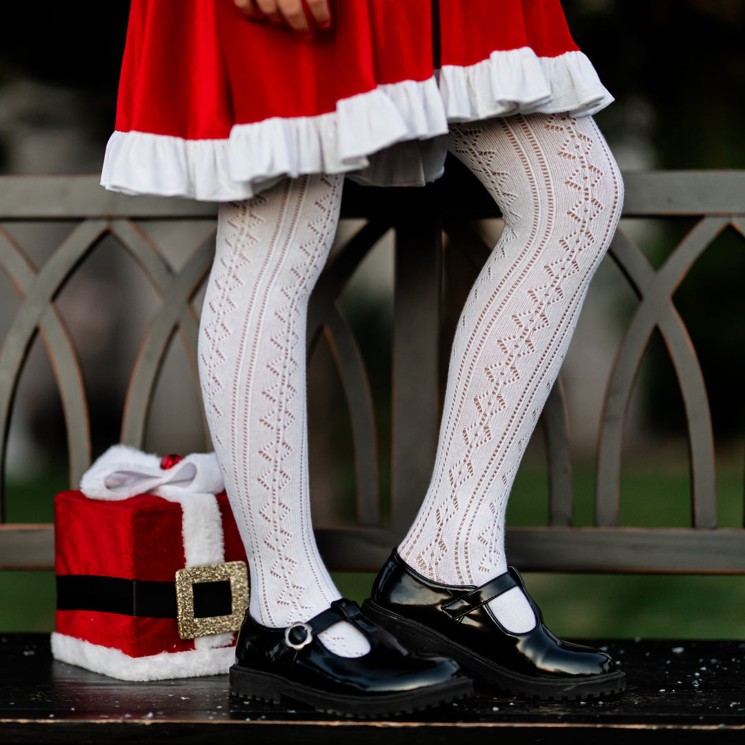 girls white pointelle knit tights and santa velvet dress and black leather shoes