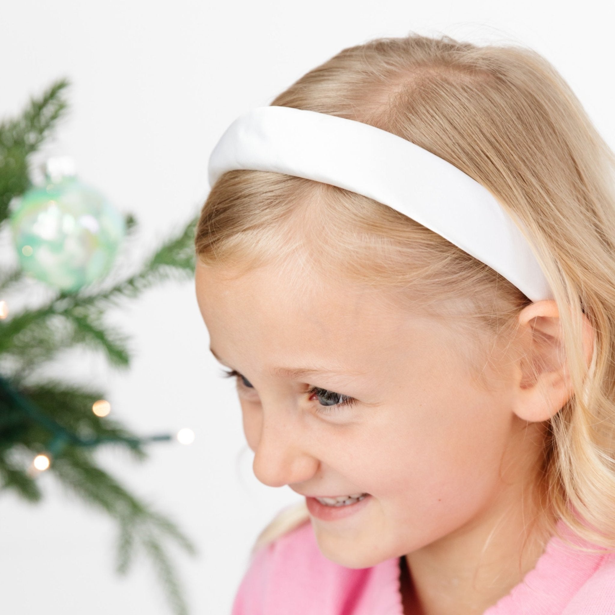 girl in white padded satin headband for Christmas