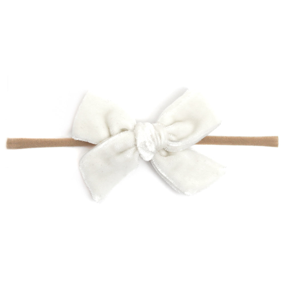 white velvet bow on soft nylon band for baby girl 