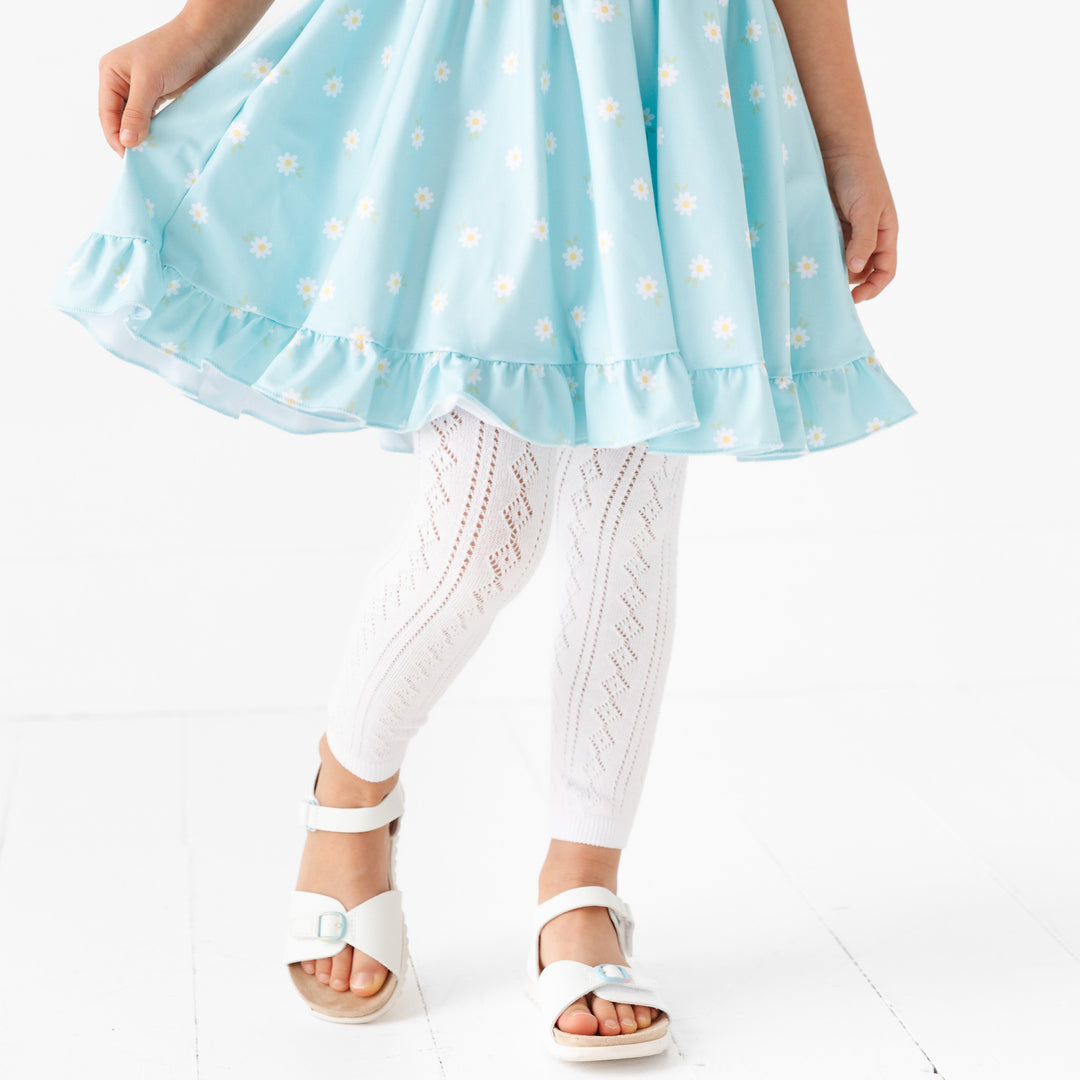 little girl in aqua daisy dress and fancy crochet knit footless tights