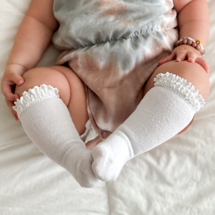 white lace knee high socks on baby girl