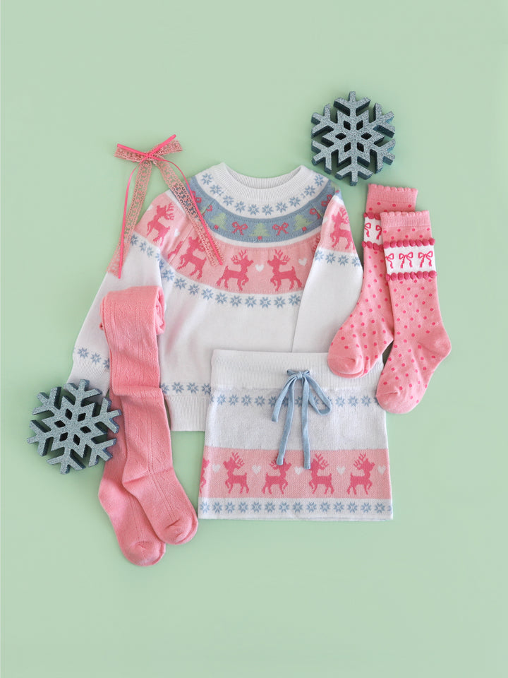 girls' white winter wonderland sweater and matching sweater skirt with pink and blue fair isle reindeer print and matching pink stockings and bow